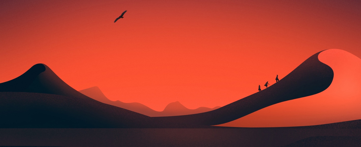 A group of people climbing up the dunes