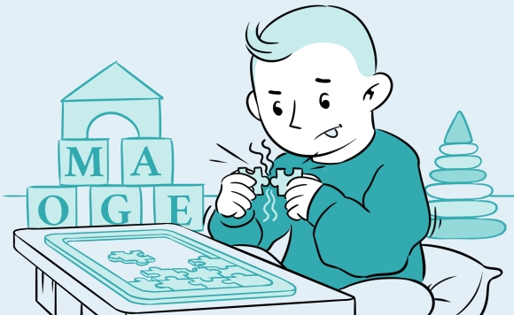 Boy struggling with a puzzle