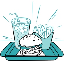 A hamburger, chips, and a coke on a tray