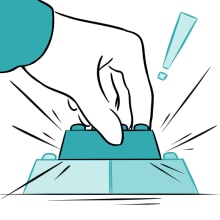 Hand putting a lego brick on top of two other bricks