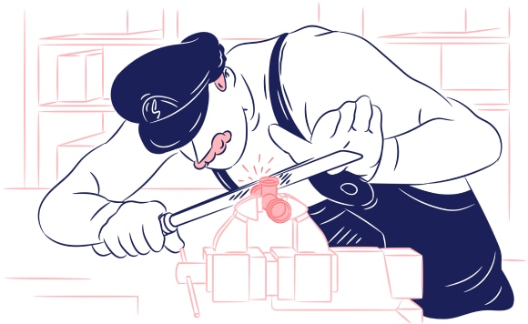 A plumber grinding a fitting