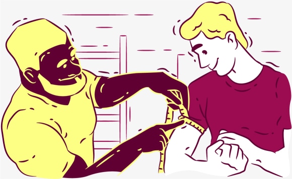 Fitness instructor measures the client's biceps