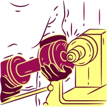 Man grinding a dumbbell on a workbench