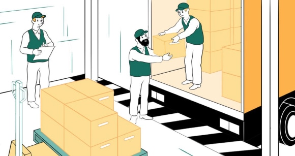 Workers unload boxes from a truck