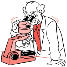 Scientist looking through a microscope