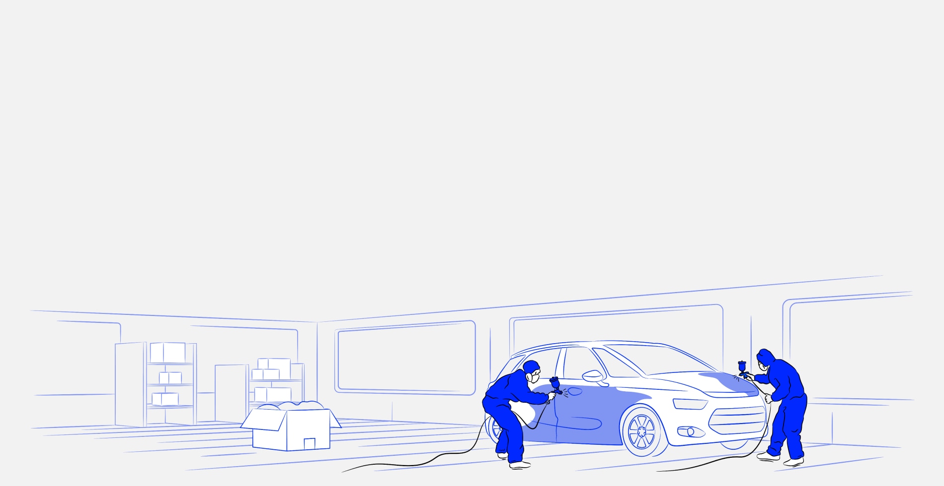 Two men painting a car in a shop