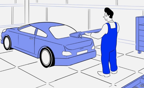 Man adding a spoiler to a car