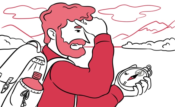 A man with a compass looking for a path