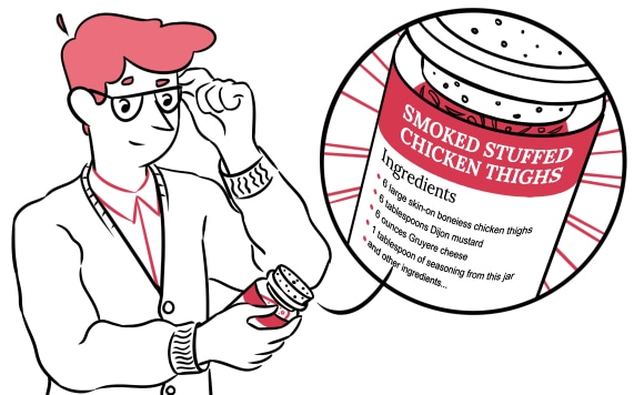 A man looking at a jar of spices with a recipe