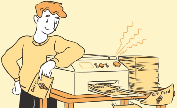 A man printing gift cards
