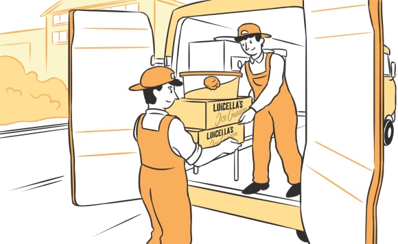 Two workers loading an ice cream truck